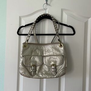 Coach gold handbag with shoulder strap and crossbody strap